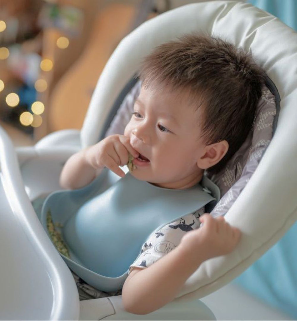 Baby Feeding with Easy Clean Silicone Weaning Bib.